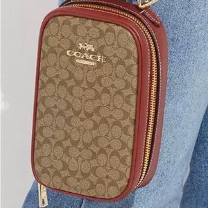 Coach EVA Phone Crossbody in micro signature canvas.
